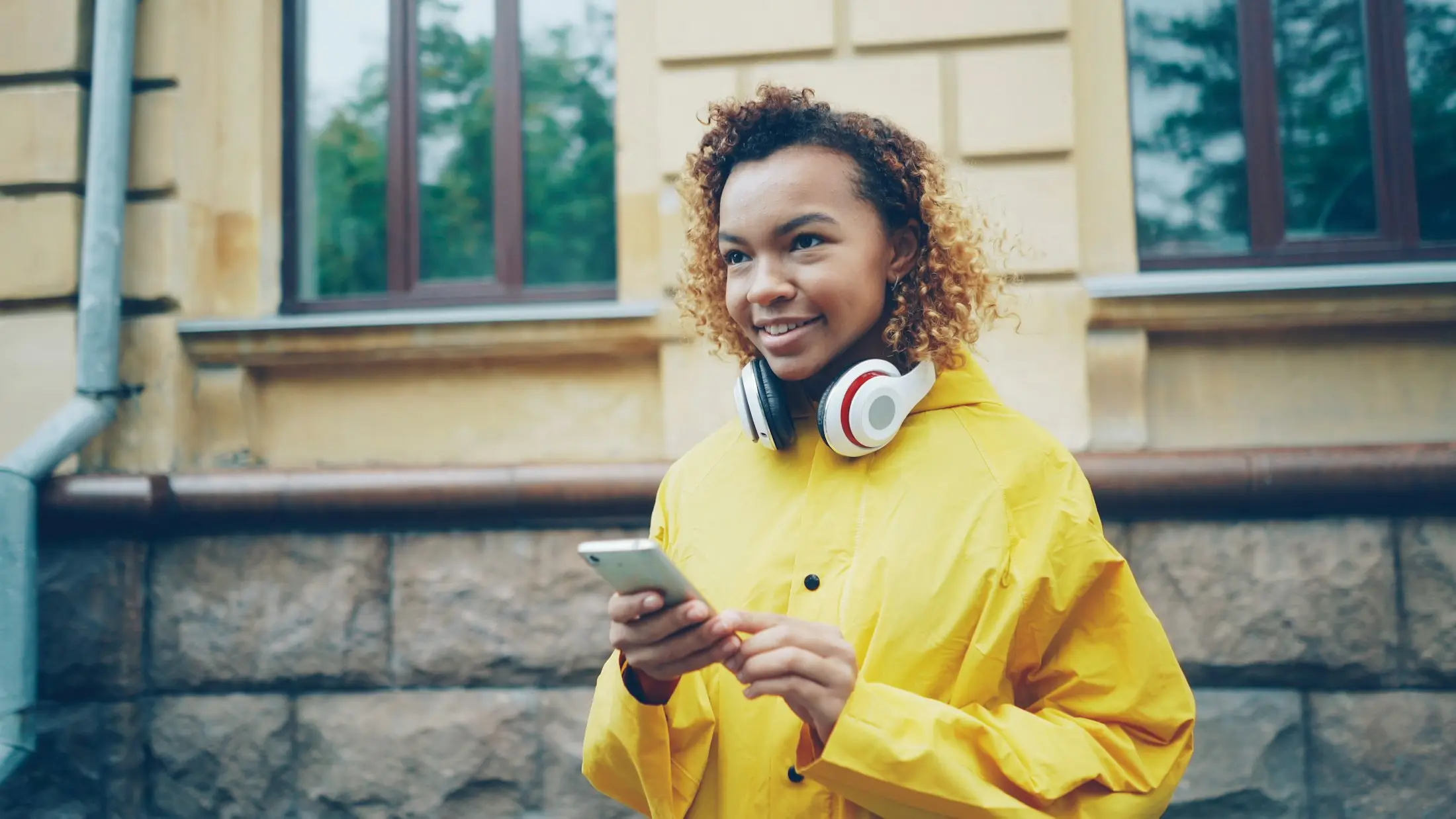 Young woman smiling at her phone